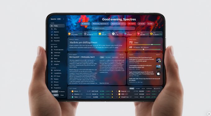 A person holds a tablet displaying a financial dashboard with the greeting 'Good evening, Spectres' and market news headlines including 'Markets are drilling lower' and 'Morning brief - Wednesday, Sep 9'.