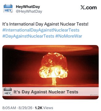 The image is a social media post from @HeyWhatDay announcing International Day Against Nuclear Tests (8/29/26), featuring a dramatic red-tinted nuclear mushroom cloud explosion graphic, which visually complements the post's playful "Boom!" reference and speculation about XRP's connection to the date.