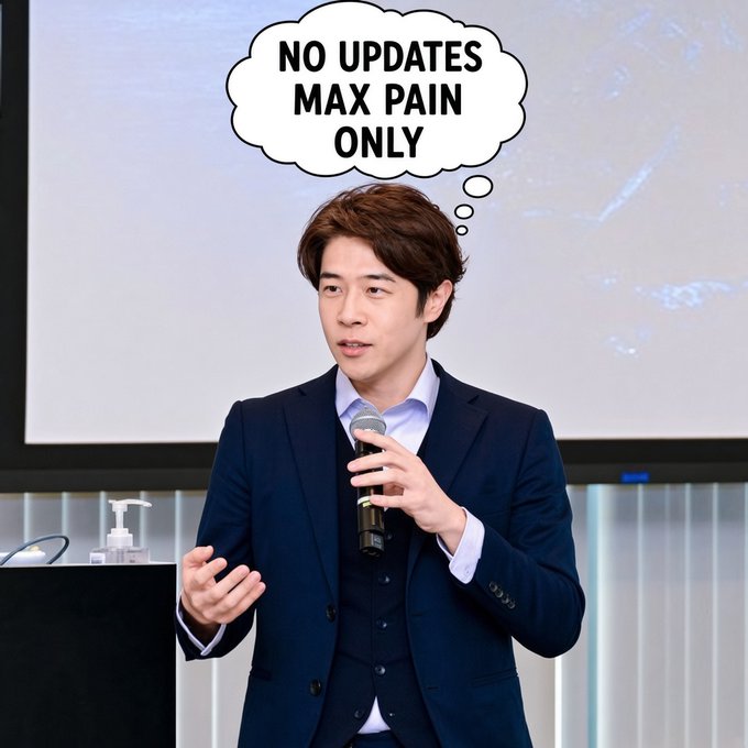 A man in a navy suit speaks into a microphone at what looks like a corporate presentation, captioned with a thought bubble reading "NO UPDATES MAX PAIN ONLY."

The image humorously illustrates the post's sentiment about wanting to see "MAX PAIN" for the $JASMY ticker—the speaker's suit-and-mic business attire evokes a formal company presentation setting, while the thought bubble jokes that the only thing investors want to hear from leadership is silence, since any update tends to trigger further price decline ("kaos and cheaper prices").