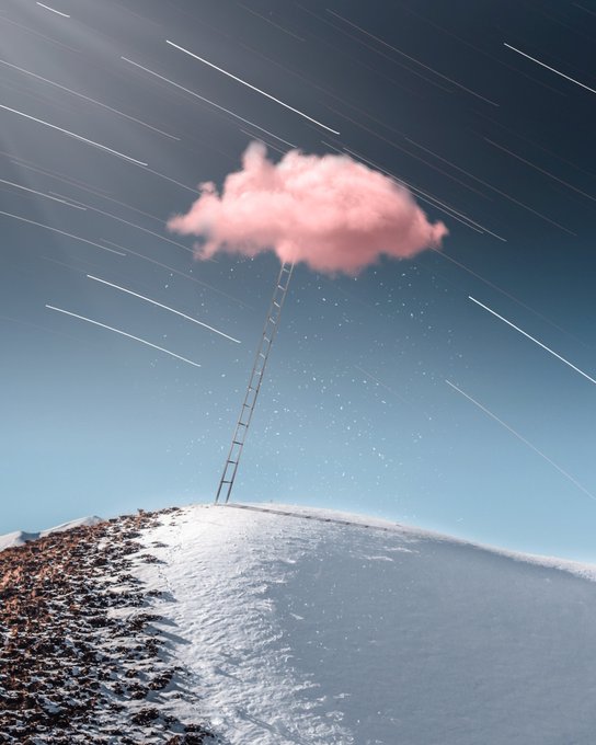 A surreal composite image showing a ladder extending from a snowy mountaintop up to a pink cloud floating in a night sky filled with star trails.
