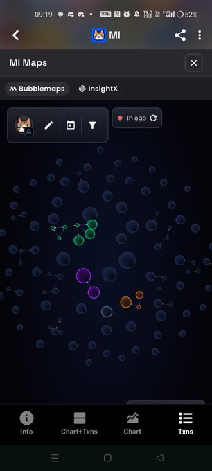 A mobile app screenshot of 'MI Maps' displaying a 'Bubblemaps' visualization with clusters of colored bubbles (green, purple, orange) on a dark blue background, showing an '1h ago' timestamp.