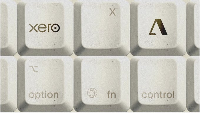 A close-up image of white computer keyboard keys, highlighting a custom key labeled "xero" alongside standard keys like option, fn, control, and an Alt-like symbol.