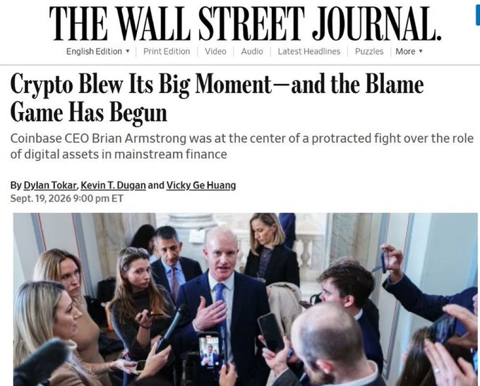 Wall Street Journal article titled 'Crypto Blew Its Big Moment—and the Blame Game Has Begun' featuring Coinbase CEO Brian Armstrong surrounded by reporters.
