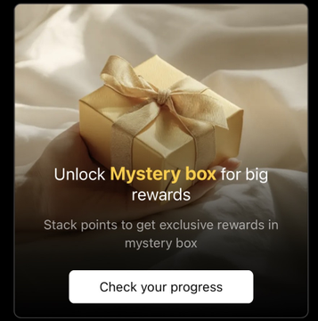 The image features a person holding a gift box with a gold ribbon, which appears to be a mystery box that can be opened for a reward. The text of the post suggests that there are rewards available for those who participate in a challenge or game within the app.