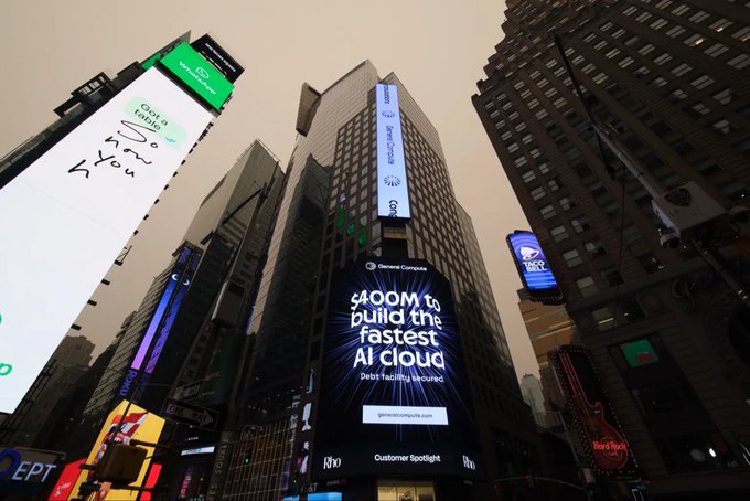 A Times Square street view featuring large digital billboards, including a prominent Genee Compute ad stating "$400M to build the fastest AI cloud. Debt Facility secured."