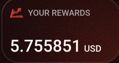 A dark red rewards card displays 'YOUR REWARDS' and a balance of '5.755851 USD' in white text.