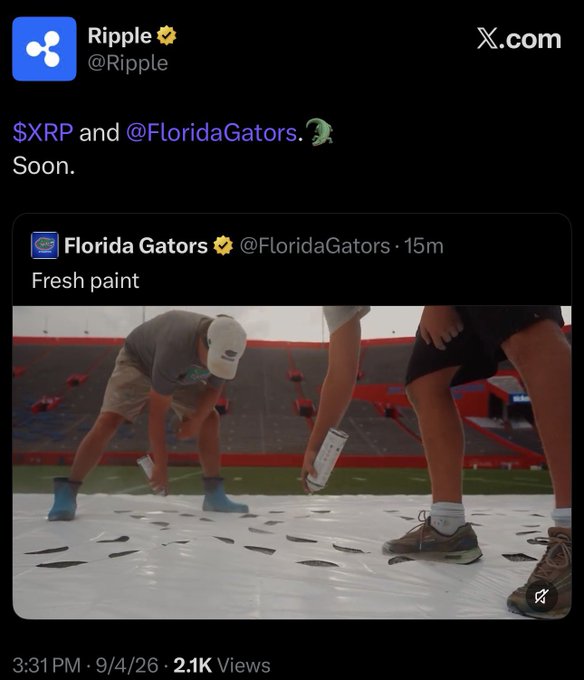 Ripple (@Ripple) quote-tweeted the Florida Gators' "Fresh paint" post with "$XRP and @FloridaGators. 🐊 Soon." — hinting at an upcoming partnership, as someone wearing blue shoe covers appears to be spray-painting a logo on the field.
