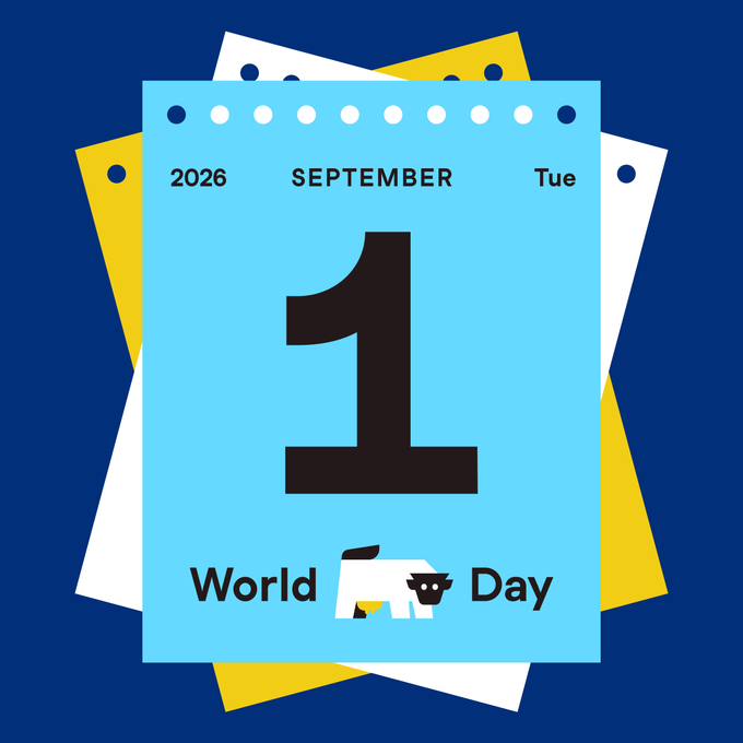 A blue calendar page displays '2026 SEPTEMBER Tue 1' with 'World [cow icon] Day' written at the bottom, set against a layered background of blue, white, and yellow pages.