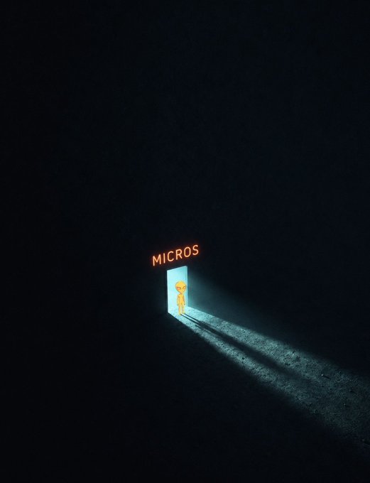 A small yellow character standing in a glowing doorway labeled "MICROS," casting a long beam of light into the surrounding darkness.