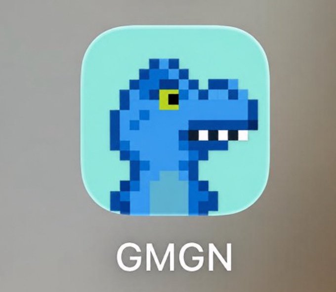 The image shows a smartphone app icon featuring a pixelated blue dinosaur with white teeth on a light teal background, labeled "GMGN" in white text below. The dinosaur pixel art evokes a retro, meme-like aesthetic that ties into the playful "fefer go to moon" sentiment, suggesting the meme coin is set to skyrocket like the dinosaur's prehistoric rise.