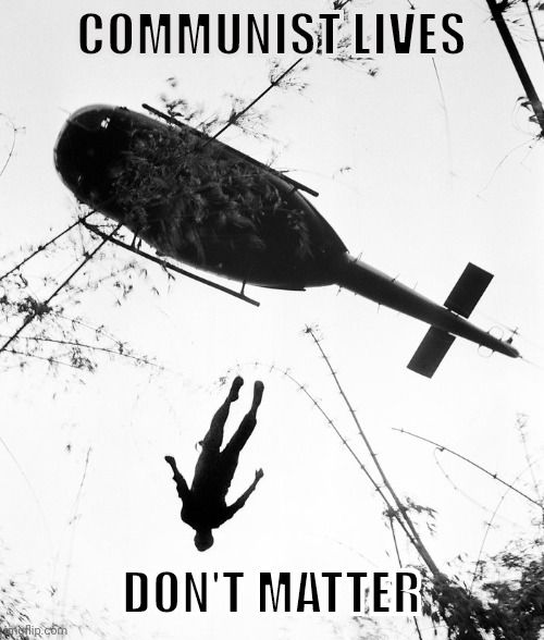 A black-and-white image shows a helicopter hovering over a person lying on the ground, with the text "COMMUNIST LIVES DON'T MATTER."
