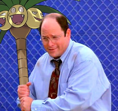 A man in a blue dress shirt and tie holds an Exeggutor Pokémon standee (from Pokémon) against a blue chain-link fence background.