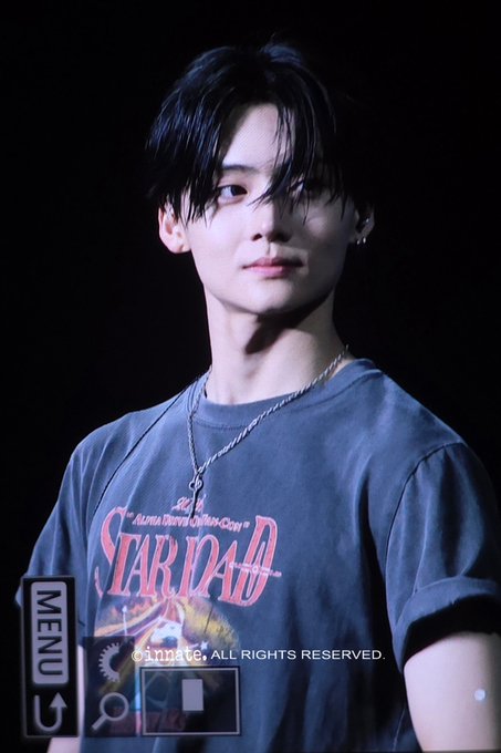 A fan captured a close-up of Sangwon from Alpha Drive One wearing a "STAR DAD" t-shirt. The hashtags in the accompanying post mention "SANGWON" and "ALD1", further connecting the image to the subject.