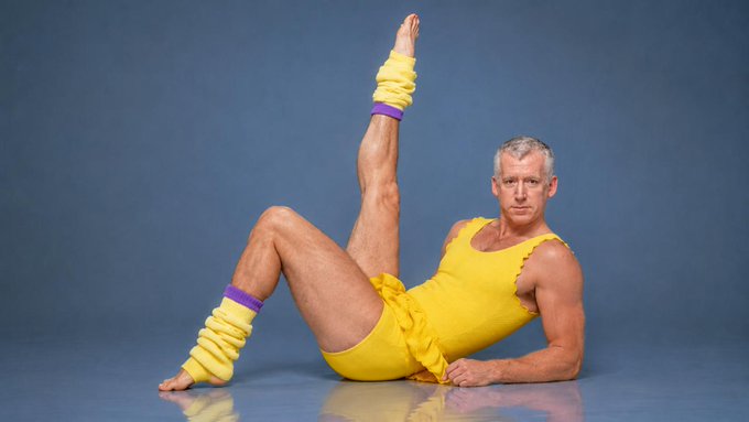 A gray-haired man in a yellow leotard and matching leg warmers strikes a one-legged pose on the floor, his expression deadpan. The retro aerobics aesthetic contrasts humorously with the DeFi TVL rankings mentioned in the post, with the man's outstretched leg and flexed foot evoking the "toilet" imagery implied by the text's punchline about a "sh*tter w/ yield."