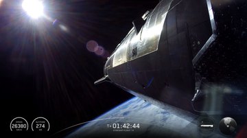 A dramatic orbital view shows the edge of Earth below and a bright sun above, with overlaid telemetry reading "SPEED 26390 KM/H," "ALTITUDE 274 KM," and a timer at "T+ 01:42:44," capturing a livestream of SpaceX's Starship Flight 14 as the post notes watching the launch while tracking the $SPCX price on Polymarket perps.