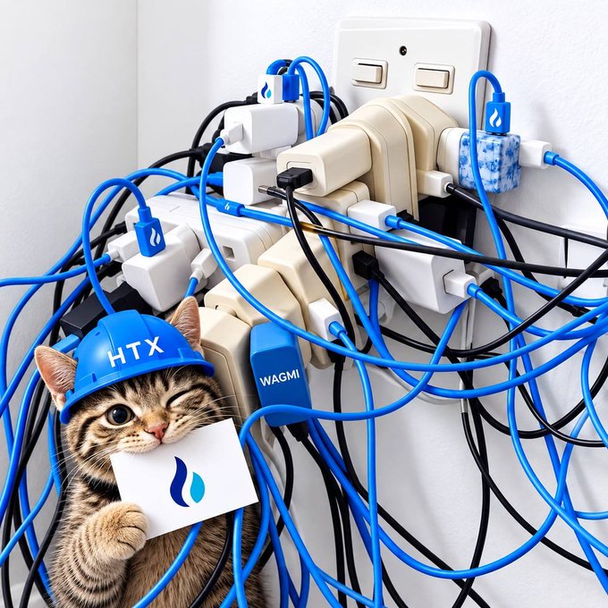 A tabby cat wearing a blue "HTX" hard hat clings to a tangled mess of power adapters and cables plugged into a wall outlet, with a "wagmi" tag and waterdrop symbols scattered among the cords—humorously illustrating how multiple crypto coins and projects (HTX, WAGMI) have investors feeling "plugged in" to countless overlapping commitments.