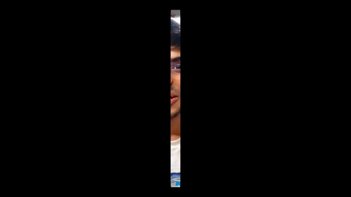 The image shows a man peeking out from behind a door, with his face obscured by a vertical black border or diagonal line. The background appears to be a dark gray color that creates a stark contrast with the man's figure. There are no other texts or objects in the frame, and the focus is on the man as he looks over the line separating him from the viewer. This scene could potentially be an advertisement or promotional image for ICYMI or another similar product or service that requires users to have certain permissions to access it fully or utilize its benefits optimally.