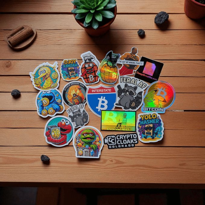 A collection of colorful pop-culture and crypto-themed stickers featuring designs with Bitcoin logos, Pepe, SpongeBob, and text including 'CRYPTO CLOAKS COLORADO' and 'YOLO MASHER'.