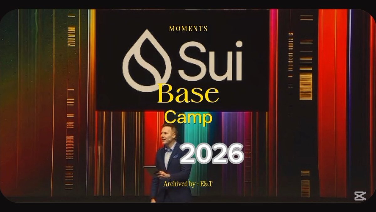 A presenter stands on stage in front of a screen displaying the Sui logo, with overlay text reading 'MOMENTS', 'Base Camp', '2026', and 'Archived by : E&T'.