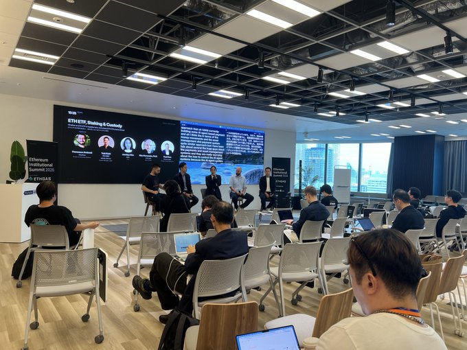 A panel discussion at the Ethereum Institutional Summit 2026 featuring speakers seated in front of a screen displaying their names and the topic 'ETH ETF, Staking & Custody.'