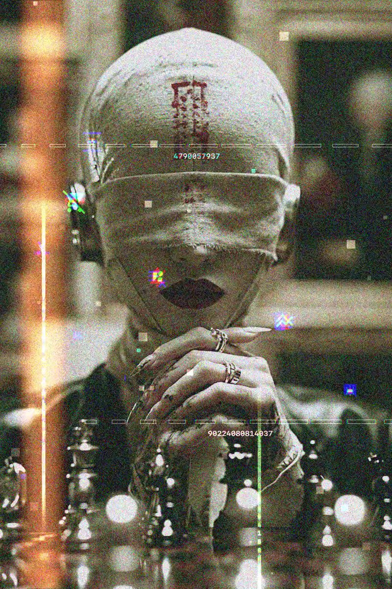 This image features an artwork that includes a person with their face covered by a large white hat. The person has long nails, which are partially visible through the hat's strap. The artist who created this piece seems to have used the hashtag #Mono.LOG in the caption. The person is also wearing multiple rings on both of their fingers and has a necklace around their neck.