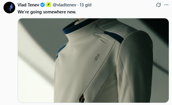 The image shows a tweet from Vlad Tenev (@vladtenev) posted 13 hours ago with the caption "We're going somewhere new," featuring a close-up photo of a white, futuristic-looking suit or jacket with a small logo on the chest. The sleek, space-themed aesthetic of the garment aligns with Tenev's cryptic teaser, suggesting Robinhood may be entering a new industry or launching an ambitious new venture without providing specific details.