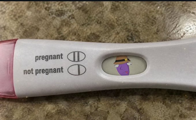 A pregnancy test showing the 'not pregnant' result, with a Patrick Star cartoon sticker edited into the result window.
