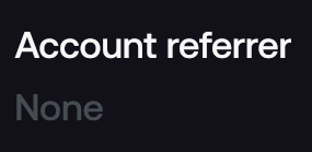 The image shows a screenshot displaying "Account referrer" with "None" listed below it, indicating that no referral has been applied to the user's account. This directly relates to the post as the user is seeking a referral code to use when setting up their @fomo trading account, and the screenshot confirms they haven't selected one yet.