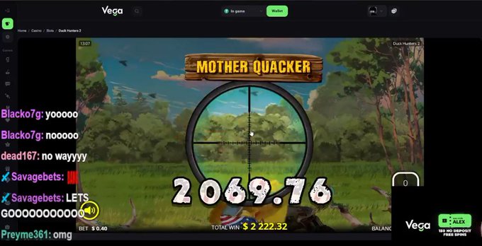 The image shows a live stream of someone playing the "Duck Hunters 2" slot game on the Vega casino platform, with a big win totaling $2,222.32 displayed prominently on the "Mother Quacker" themed game screen, while the chat celebrates the $2,000 win mentioned in the post.