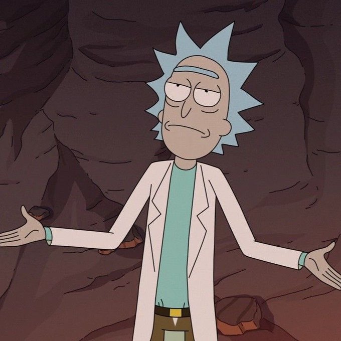 Rick Sanchez from Rick and Morty stands in a cave with his arms outstretched in a shrugging gesture, wearing his typical white coat and spiky blue hair.