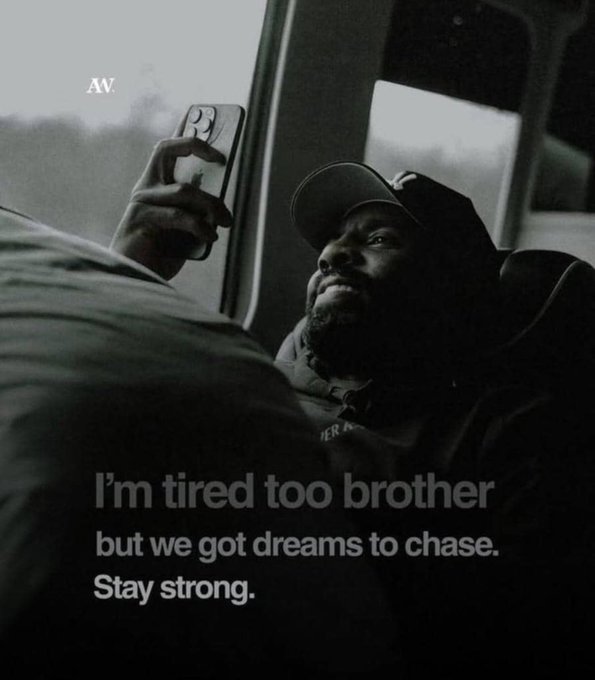 Inspirational quote graphic over a moody photo of a man in a cap on a bus: 'I'm tired too brother but we got dreams to chase. Stay strong.' branded 'AV.'