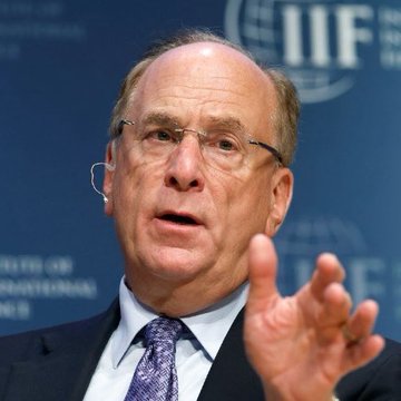 Larry Fink, CEO of BlackRock, is shown mid-speech gesturing with his hand, with the Institute of International Finance (IIF) logo visible in the background, in an image that accompanies news of BlackRock clients selling $219.41 million worth of Bitcoin.