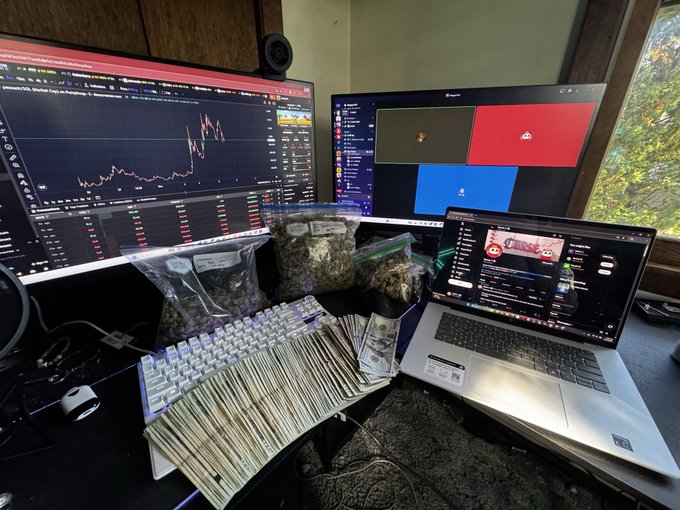 A trader's multi-monitor setup displays a token/crypto chart alongside Discord (showing the "$FUN" community), with several bags of cannabis and a large fan of cash on the desk—visually supporting the "GM DEGEN" post that focuses on @timesoulcom's product lineup update for a daily-use application, the same kind of "essential daily use" consumables shown prominently in the photo.