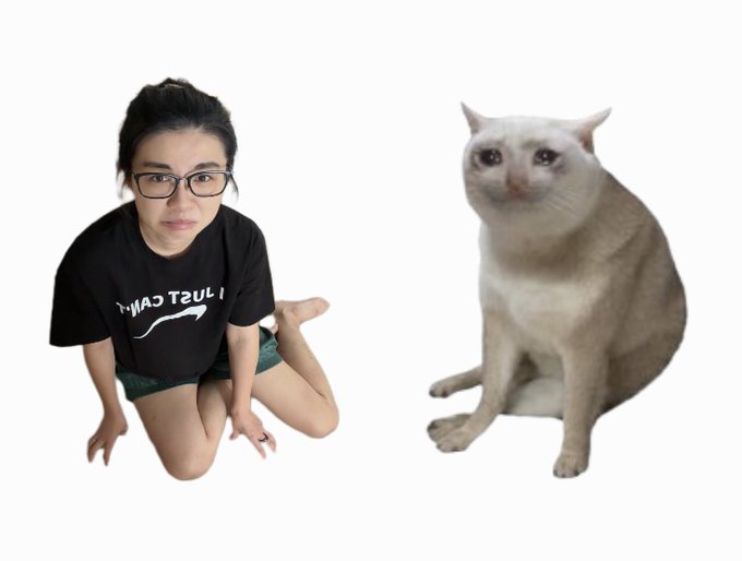 A young woman wearing glasses and a 'Just CAMP' t-shirt sitting next to a white cat with a grumpy expression.