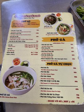 The image shows a Vietnamese menu from "Phở Hương" featuring various phở options including Phở Gà (chicken), Phở Bò Tự Chọn (beef), and mixed dishes with prices ranging from 55k-75k VND (~$2-4), supporting the post about this longtime Ho Chi Minh City establishment offering affordable meals.