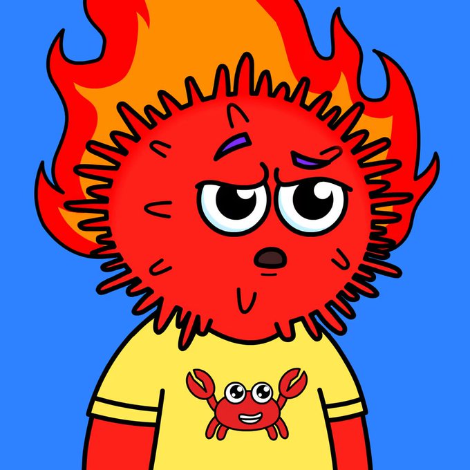 A cartoon illustration of a red, fluffy creature with fiery orange and yellow hair, wearing a yellow t-shirt featuring a smiling crab design, set against a bright blue background.