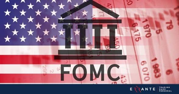 A graphic showing an American flag background with a Federal Reserve building icon and the text "FOMC," branded with "ERRANTE TRADING."