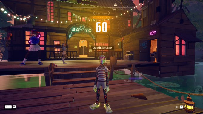 A character named "-JustinBouken-" stands in front of a glowing "BAYC" Swamp Clubhouse in OthersideMeta, celebrating reaching level 60 with a score of "60" displayed prominently above their head. The screenshot captures the milestone moment at the Bored Ape Yacht Club-themed virtual venue.