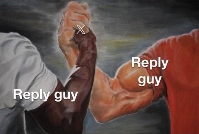 A meme showing two muscular arms in an arm-wrestling pose, both labeled "Reply guy," depicts the phenomenon where everyone is competing to be the first person to reply to a post for engagement. The image humorously illustrates how no matter how many "reply guys" show up, they're all doing the same thing, playing into the post's call to "type 'Hi'" to boost engagement metrics.