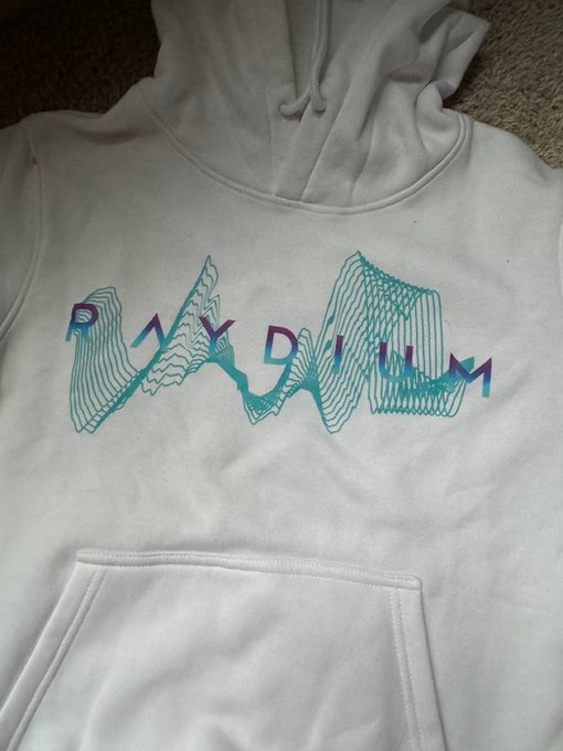 A white hoodie laid flat featuring a teal and purple graphic design that reads "PLAY DIUM".