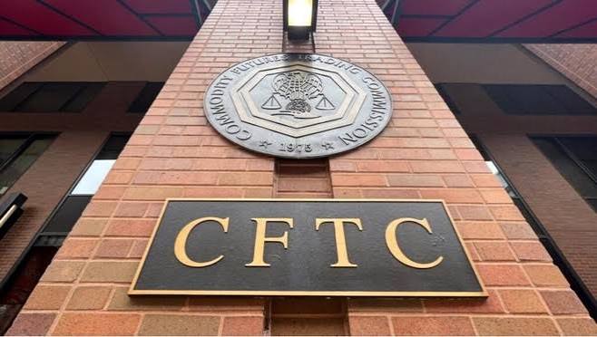 The image shows the entrance of the U.S. Commodity Futures Trading Commission (CFTC) headquarters, featuring its official seal and the gold "CFTC" lettering on the brick facade. This relates to the post about the CFTC considering new regulations that would allow crypto exchanges to offer leveraged and margin trading, marking a potential milestone for U.S. crypto legislation and market recovery.