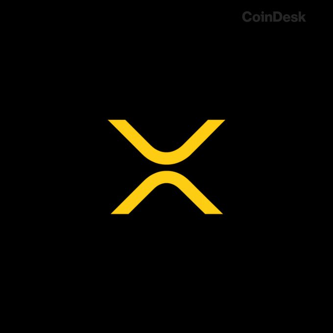 In the center of the black background, there's an intriguing symbol, which appears to represent Bitcoin. The symbol consists of two curved arrows intersecting each other within a yellow line, forming an "X" shape. This distinctive logo has been featured in several posts and articles aboutBitcoin, such as one that mentions its value dropping by $2.63 for every $1 gained in profit, indicating a bear market is approaching exhaustion. The context of the image suggests that it might be associated with CoinDesk or another platform where cryptocurrency-related information is shared.