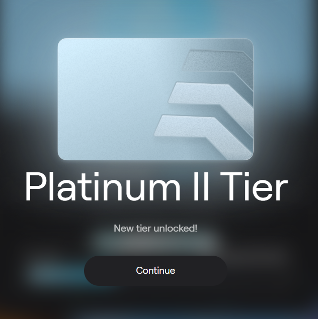 A digital achievement screen displaying 'Platinum II Tier' with 'New tier unlocked!' and a 'Continue' button, featuring a silver card with geometric arrow designs.
