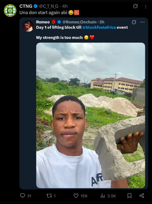 A young man in a white t-shirt holds up a concrete block during his first day lifting blocks for the @blockfestafrica event, as shared by @RomeoOnchain and quoted by CTNG with the playful caption "Una don start again abi." The image illustrates the humble physical labor that, according to the accompanying post, marked the pivotal beginning of his creator journey.