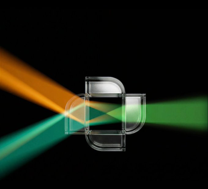 An abstract digital artwork featuring a translucent 3D geometric shape resembling overlapping rounded squares, intersected by diagonal orange and green light beams against a solid black background.