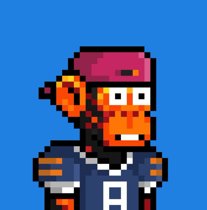 Pixel art of an orange-skinned character wearing a pink cap and a blue jacket with a large letter "A" on it, set against a blue background.