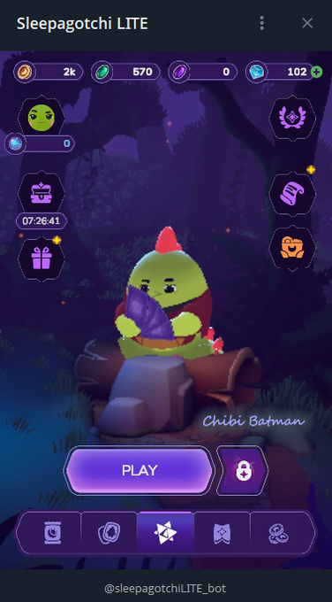 A screenshot of the "Sleepagotchi LITE" Telegram game interface showing a "Chibi Batman" character holding a purple crystal, with resources displayed as 2k coins, 570 green gems, 0 purple gems, and 102 blue gems, alongside a "PLAY" button and various menu icons. The image illustrates the post's description of the game's straightforward gameplay, displaying the character collection and resource management elements that players engage with during short play sessions.