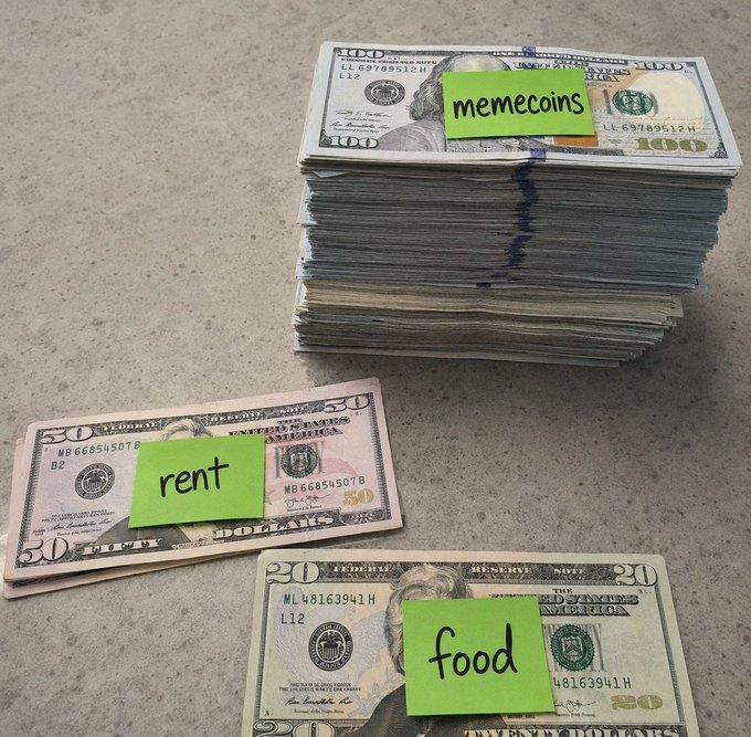 A tall stack of $100 bills labeled "memecoins" towers over a single $50 bill marked "rent" and a $20 bill marked "food," humorously illustrating how crypto speculation dwarfs basic living expenses.