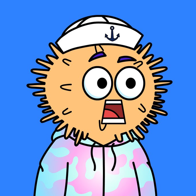 A cartoon illustration of a shocked-looking character with messy orange hair, wide eyes, and a sailor hat with an anchor symbol, set against a blue background.
