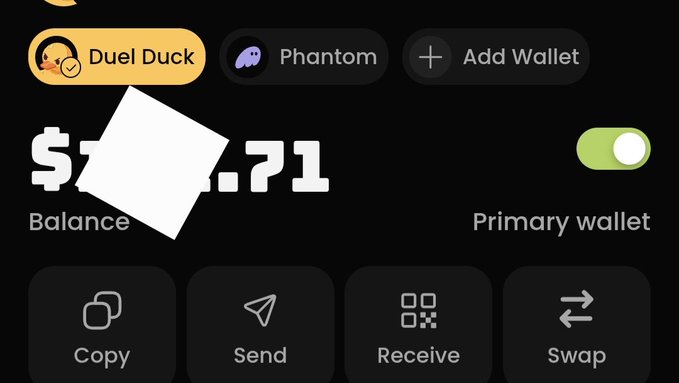 A dark-themed cryptocurrency wallet interface displays tabs for 'Duel Duck' and 'Phantom' at the top, with a partially obscured balance, a 'Primary wallet' toggle switched on, and action buttons for 'Copy', 'Send', 'Receive', and 'Swap'.